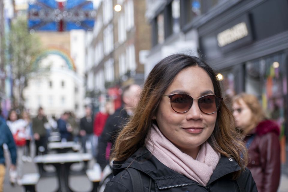 Client photographed on a private street photography walk through central London, shot in available light by Aby Abhyankar — frame 39 of 79.